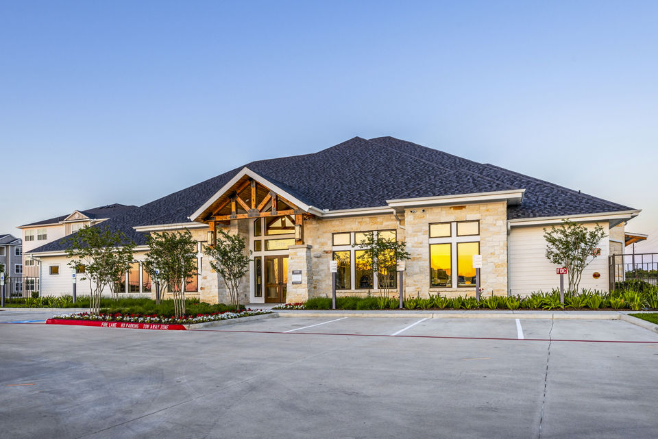 Clubhouse featuring modern design and seating area at Allora Alamo Heights Apartments
