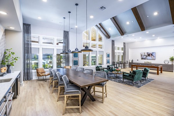 Modern clubhouse with comfortable seating and ambient lighting at Allora Alamo Heights Apartments, ideal for resident gatherings and relaxation