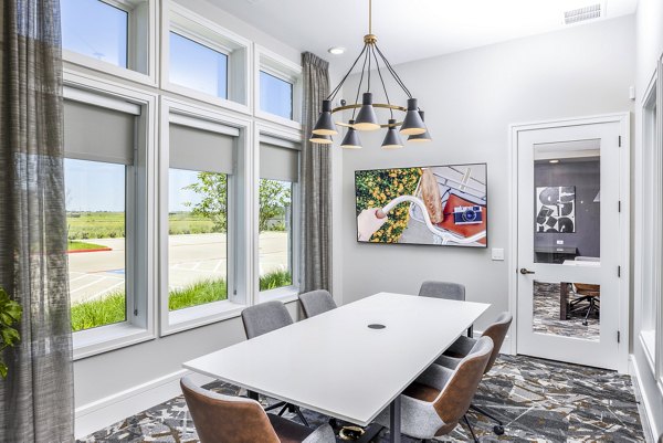 Modern clubhouse meeting facility with sleek furnishings at Allora Alamo Heights Apartments