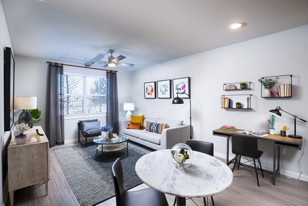 Spacious living room with modern decor in Allora Alamo Heights Apartments