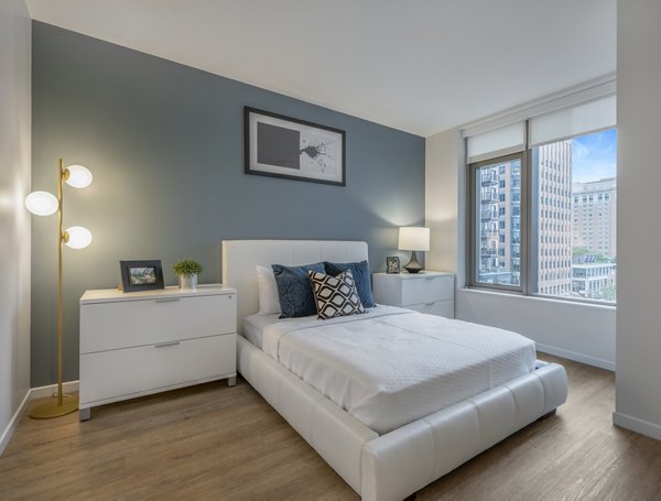 Bedroom featuring contemporary design and luxury finishes at The Alyx Apartments