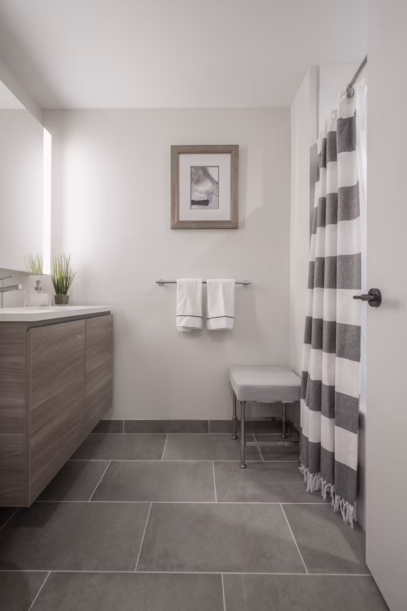 Bathroom featuring modern fixtures and elegant design in The Alyx Apartments