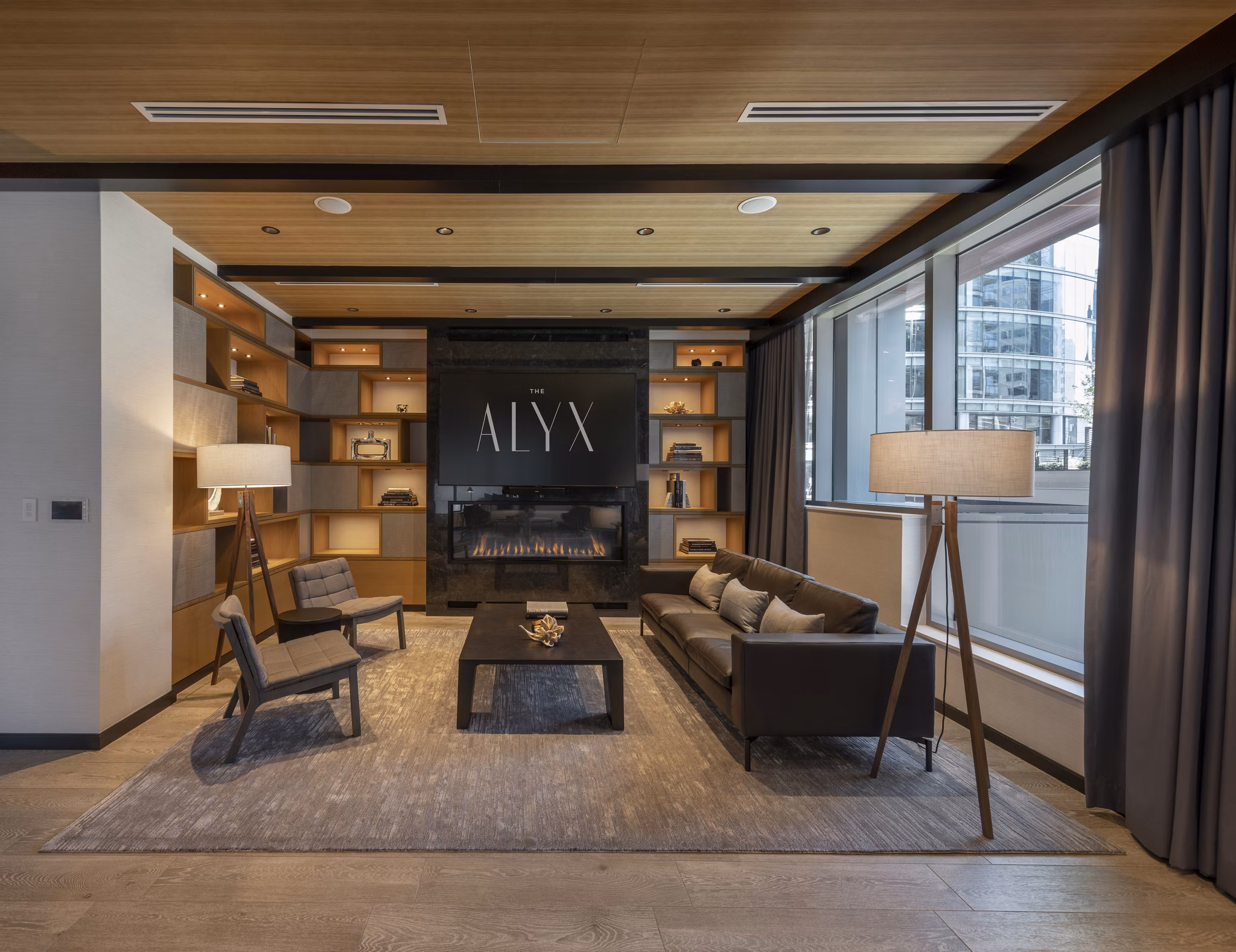 Modern clubhouse featuring sleek design and indoor seating at The Alyx Apartments