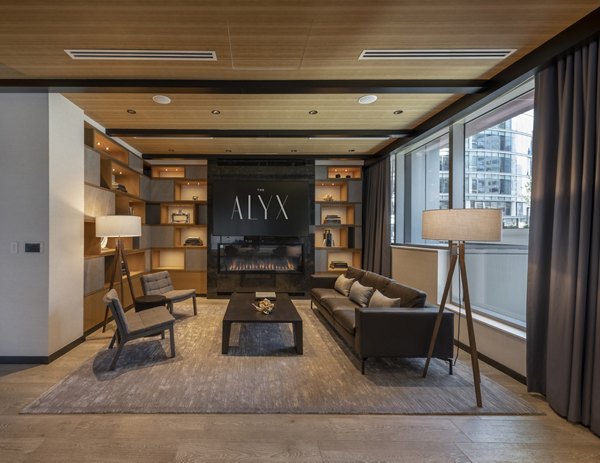 Modern clubhouse featuring sleek design and indoor seating at The Alyx Apartments
