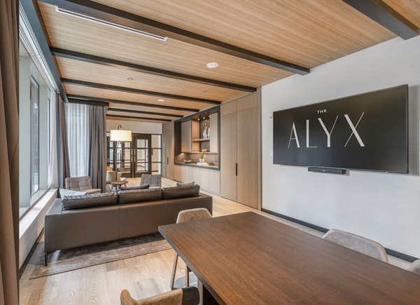 Clubhouse with modern design and comfy seating at The Alyx luxury apartments