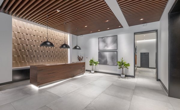 Clubhouse featuring modern design and cozy seating at The Alyx Apartments