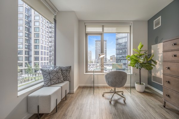 Home office featuring modern desk and ergonomic chair at The Alyx Apartments