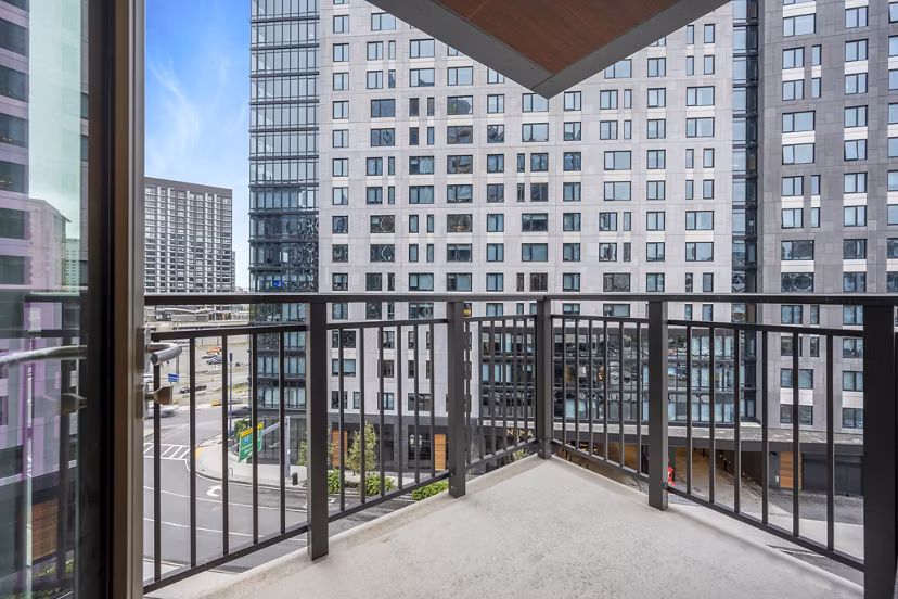 Spacious patio with modern seating at The Alyx Apartments, ideal for relaxation and outdoor gatherings in an upscale residential setting