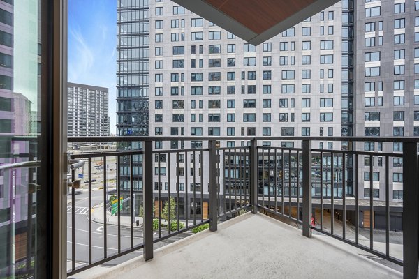 Spacious patio with modern seating at The Alyx Apartments, ideal for relaxation and outdoor gatherings in an upscale residential setting