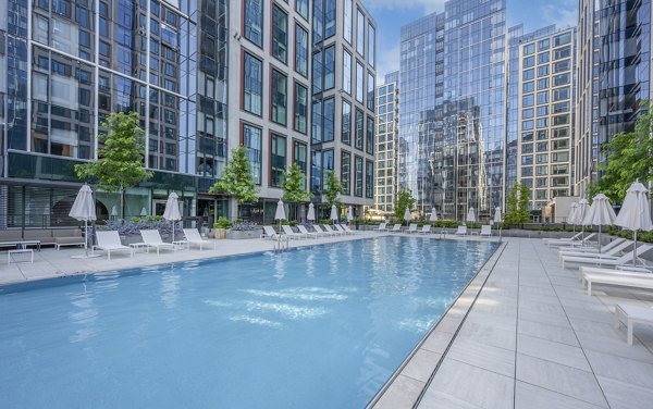 Rooftop pool at The Alyx Apartments offering stunning city views