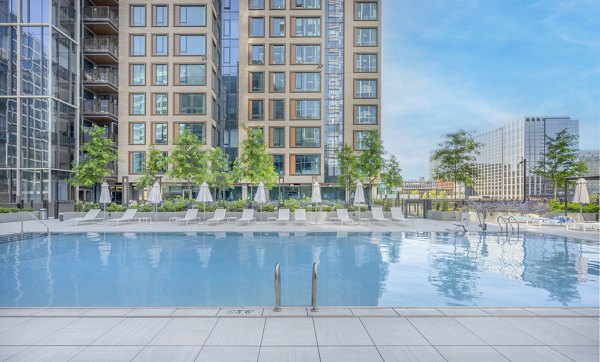 Luxury pool with sundeck at The Alyx Apartments offering modern leisure amenities