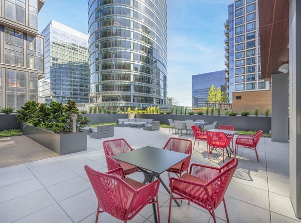 The Alyx Apartments: Tranquil courtyard with lush landscaping and seating areas for relaxation and socializing