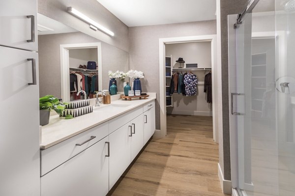 Bathroom featuring sleek fixtures and contemporary design at Sunela Apartments