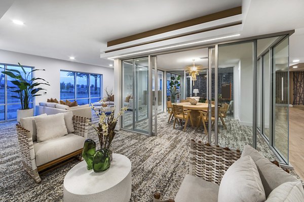 Elegant clubhouse with modern decor and cozy seating at Sunela Apartments