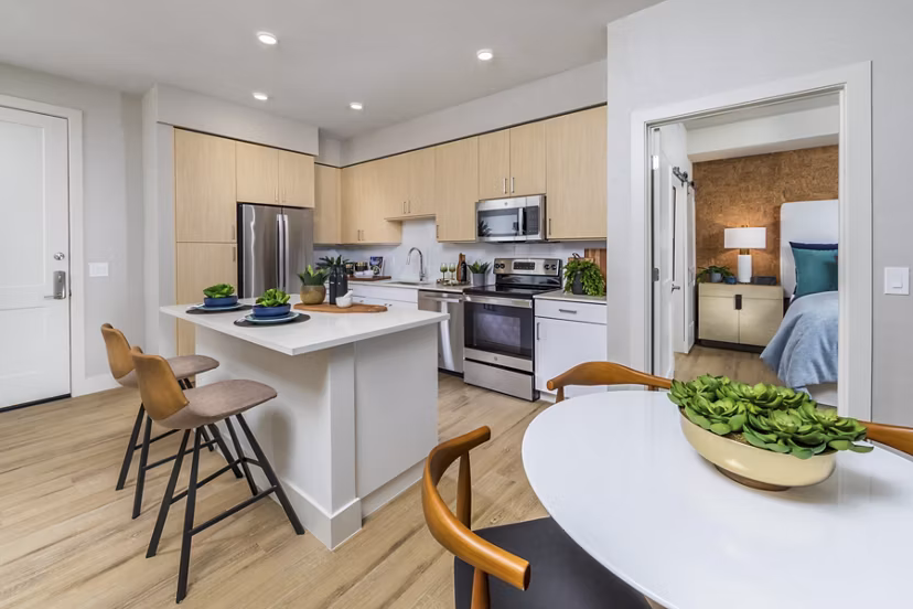 Modern kitchen with stainless steel appliances in Sunela Apartments