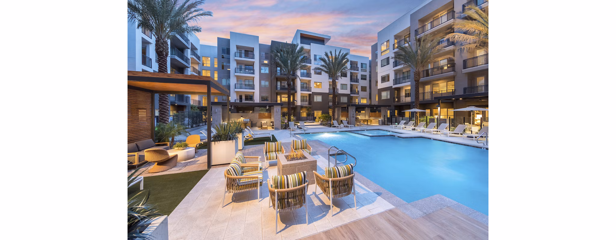 Inviting pool area with lounge chairs at Sunela Apartments, a Greystar luxury property