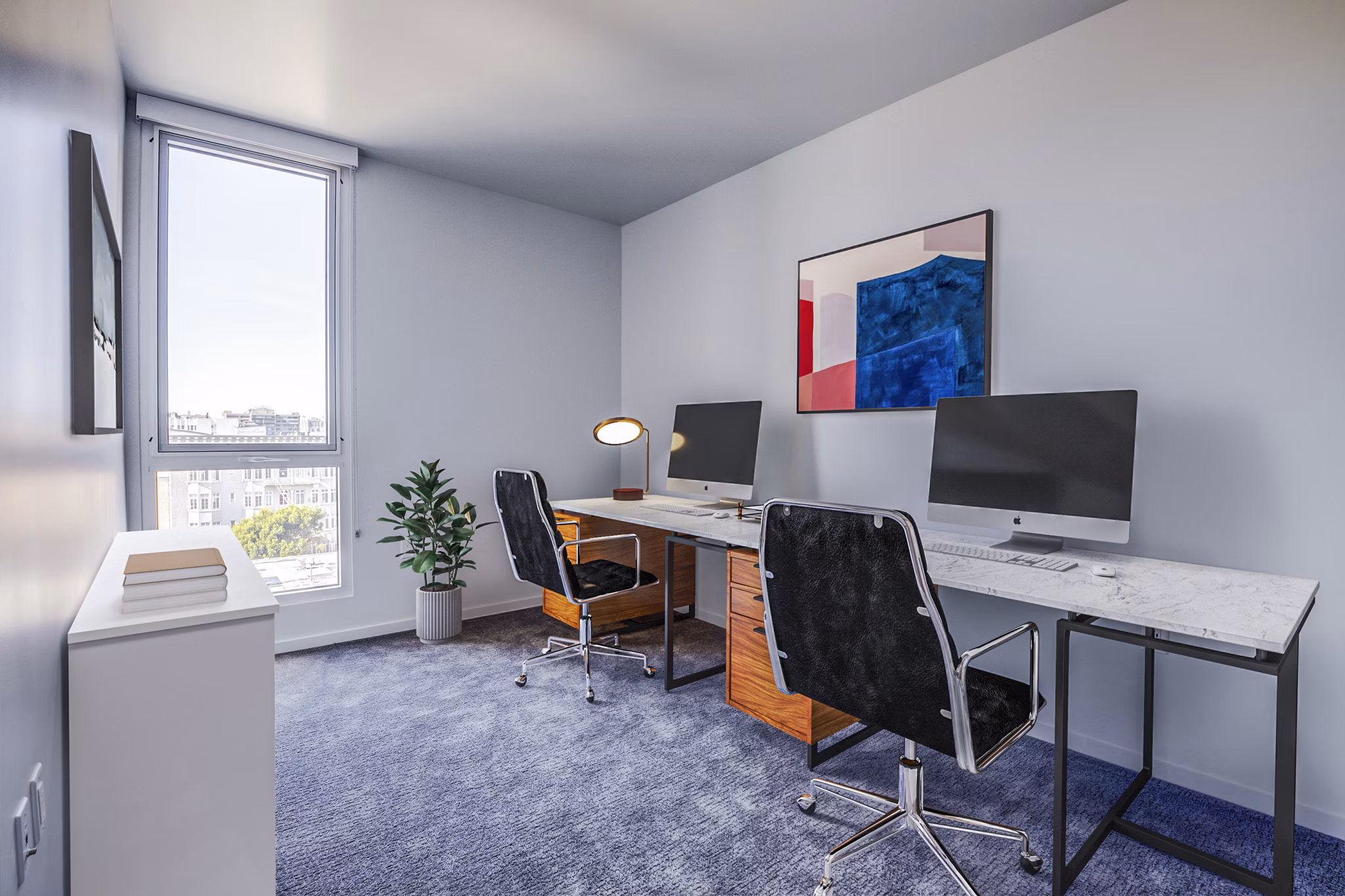 Home office with modern decor and natural light at Vance Apartments, a luxury Greystar community