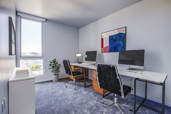 Home office with modern decor and natural light at Vance Apartments, a luxury Greystar community