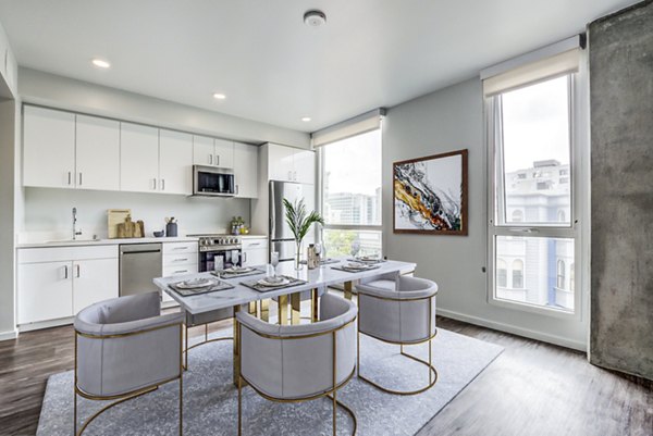 Dining room with elegant lighting and modern decor in Vance Apartments