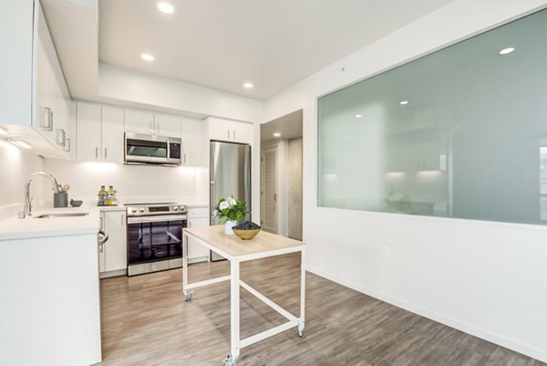 Contemporary kitchen with stainless steel appliances at Vance Apartments, Greystar luxury apartments in a prime location