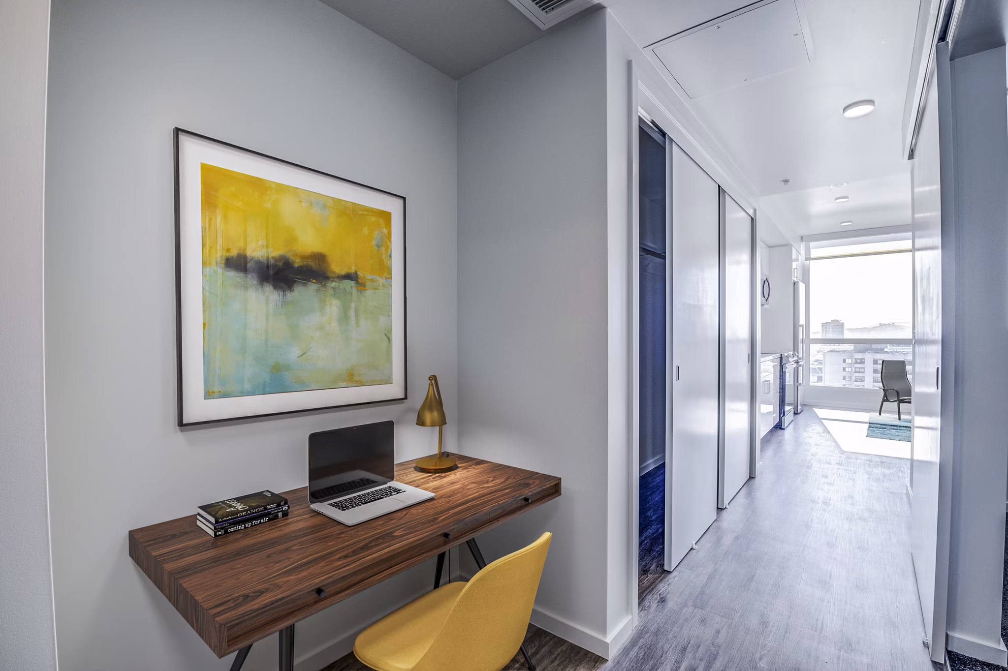 Home office space with ergonomic chair and desk setup at Vance Apartments