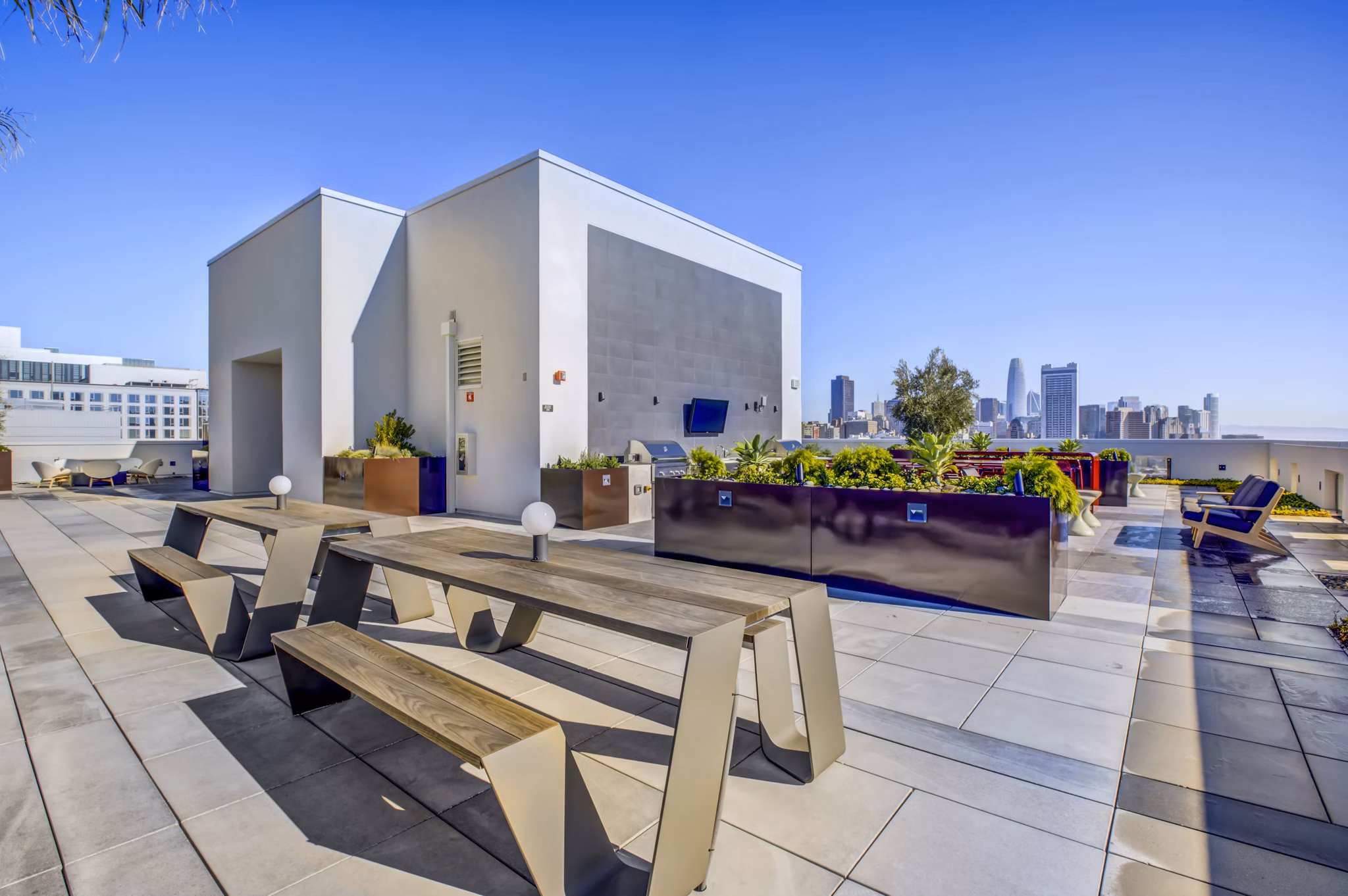 Chic patio balcony with modern furniture at Vance Apartments, offering city views and outdoor relaxation space