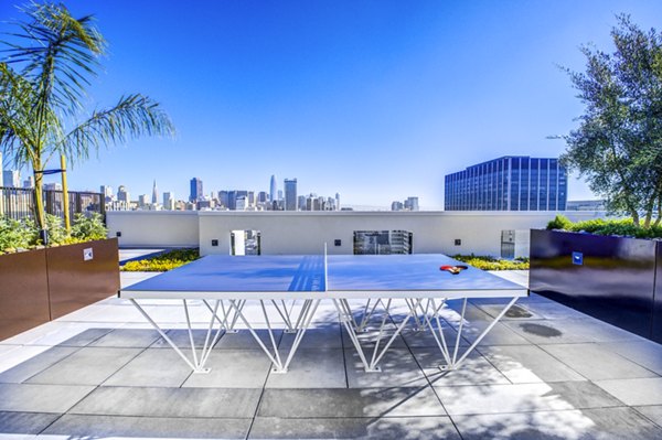 Outdoor patio with modern seating in Vance Apartments, perfect for relaxation and community gatherings