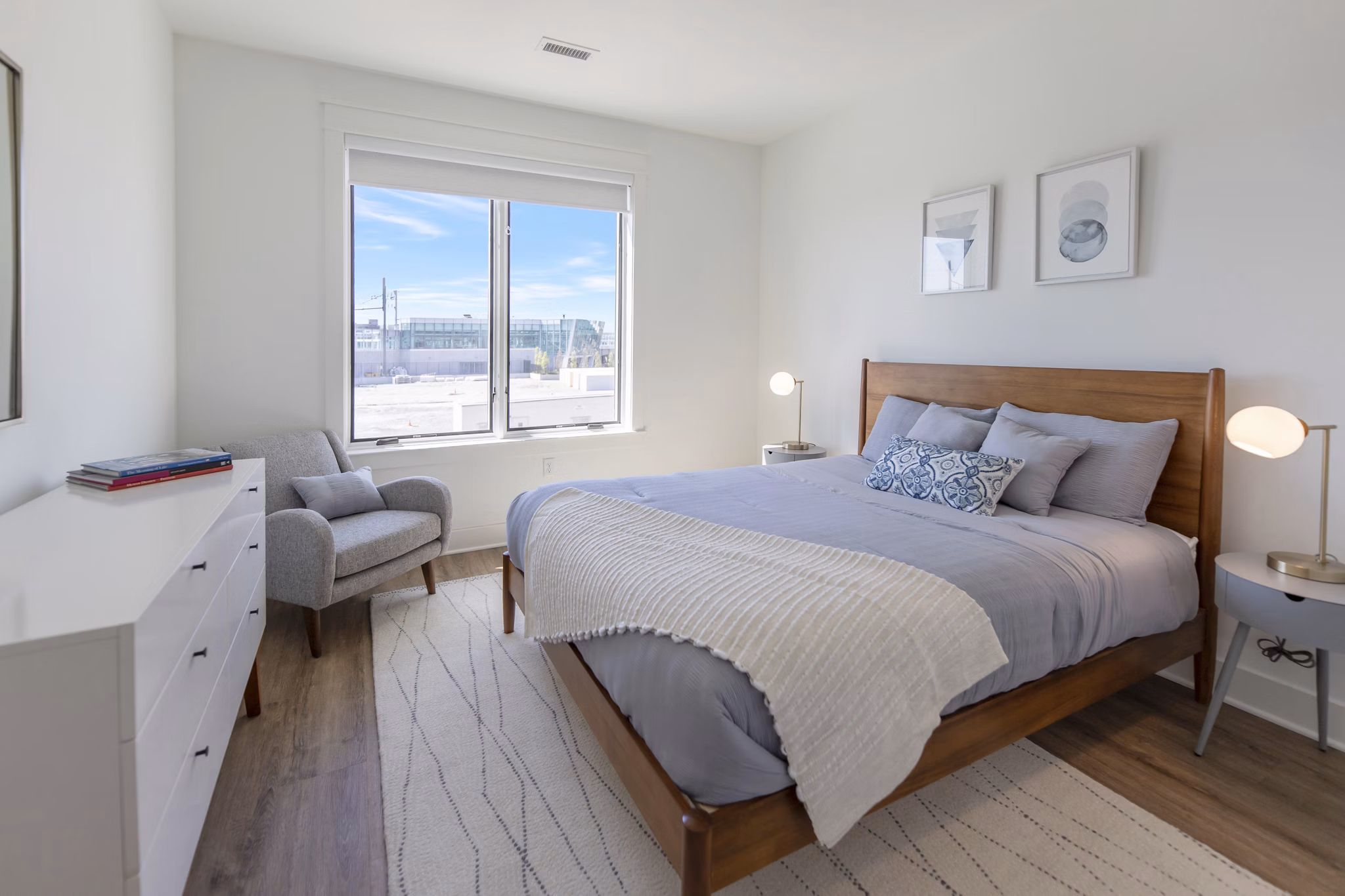 Contemporary bedroom with chic decor at Harrison Yards Apartments