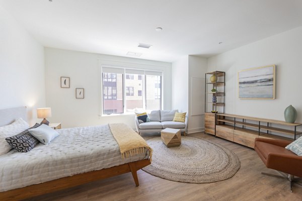 Spacious bedroom with modern furnishings at Harrison Yards Apartments