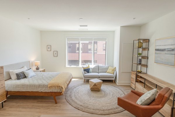 Cozy bedroom with modern decor in Harrison Yards Apartments