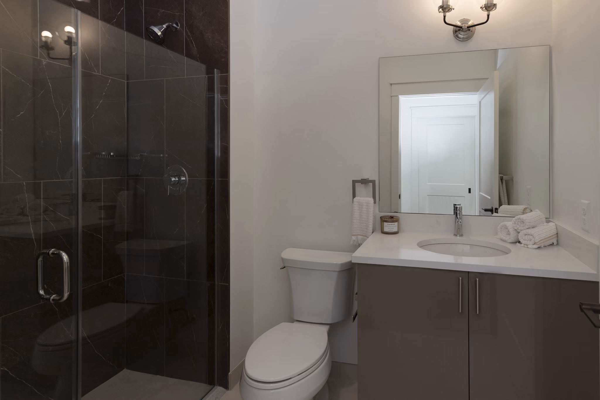 Sleek bathroom with modern fixtures at Harrison Yards Apartments, luxury living experience in a prime urban location