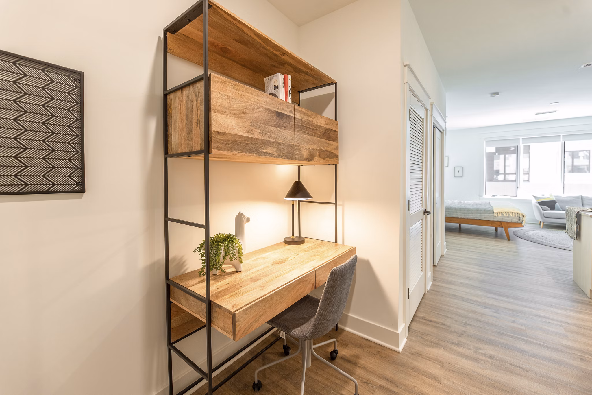 Bright home office with modern desk and chair at Harrison Yards Apartments