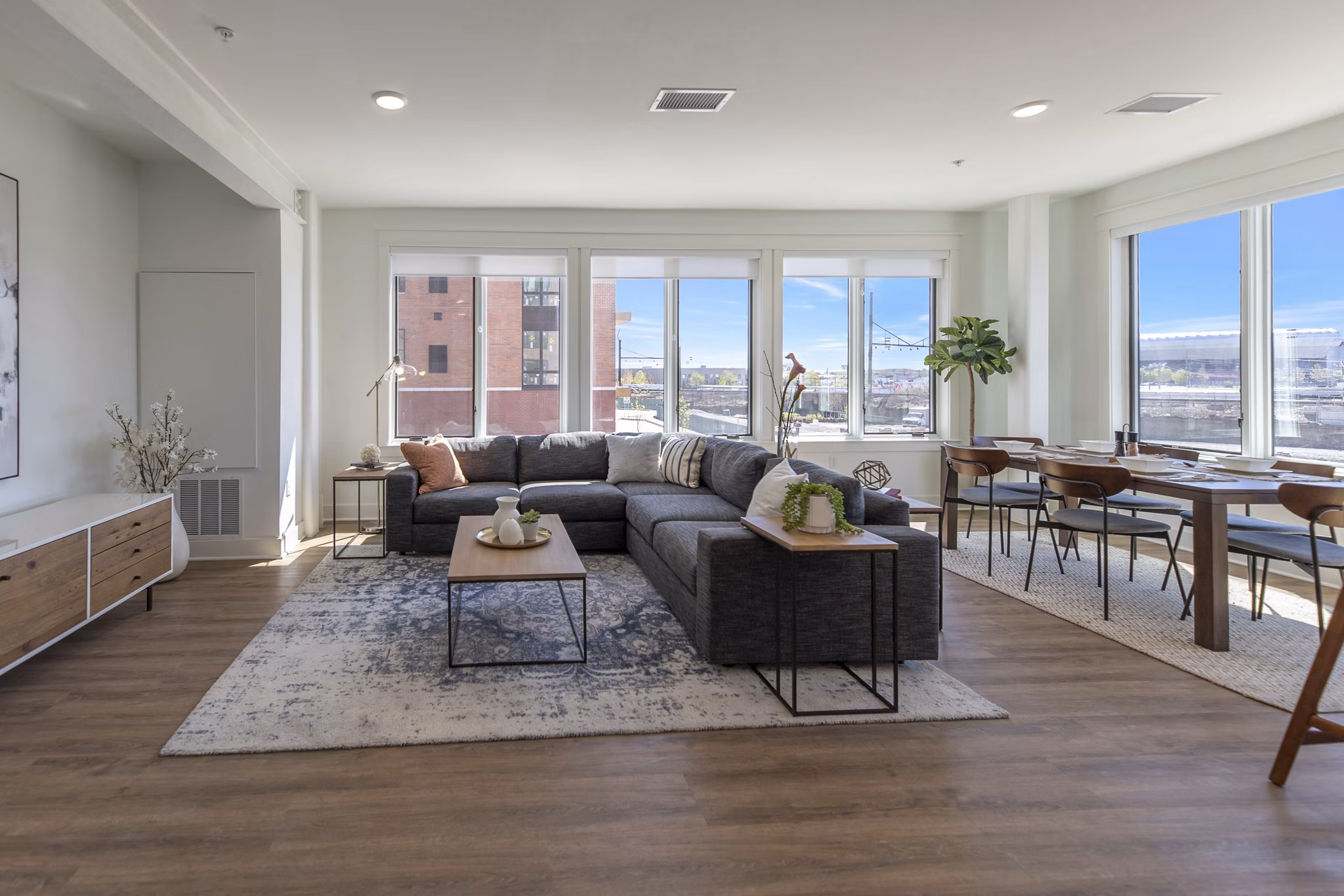Contemporary living room with sleek furnishings at Harrison Yards Apartments