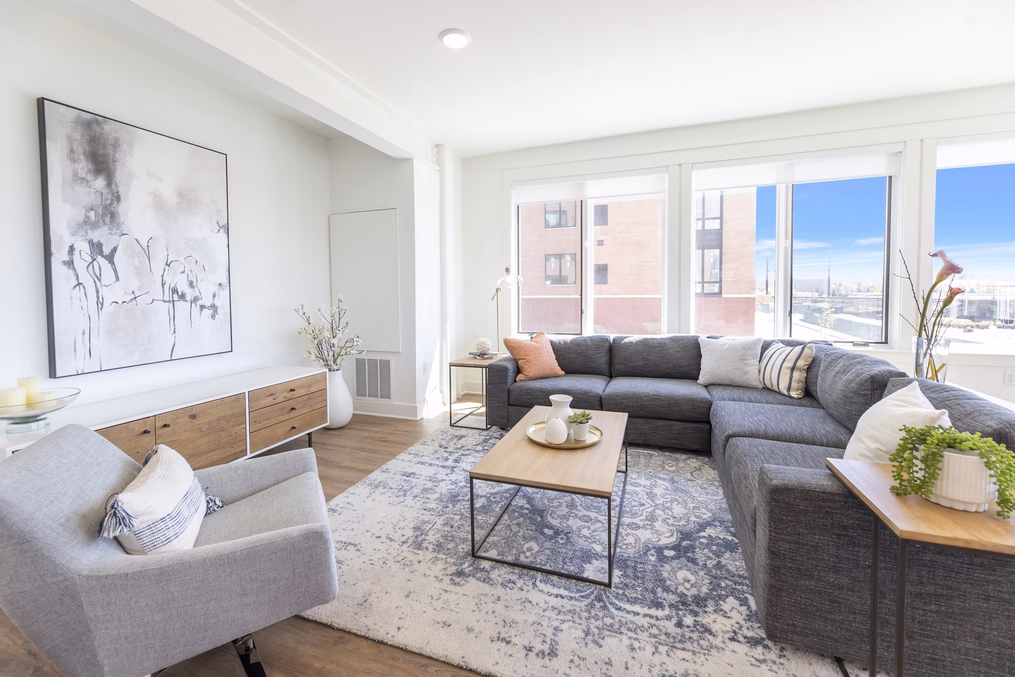 Spacious living room with modern furnishings at Harrison Yards Apartments
