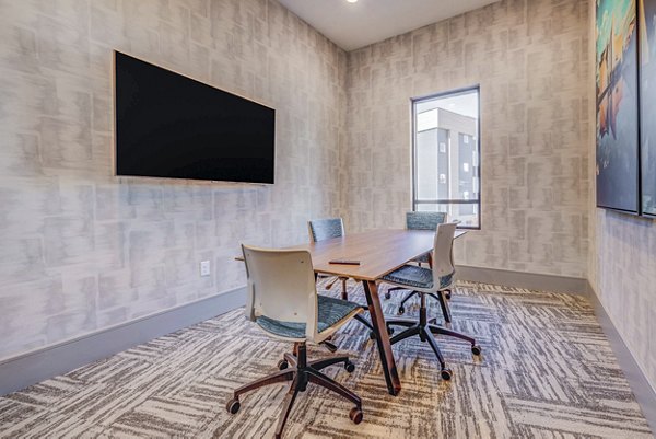 Modern clubhouse meeting facility with sleek design at Reveal Apartments, perfect for luxury gatherings and business meetings