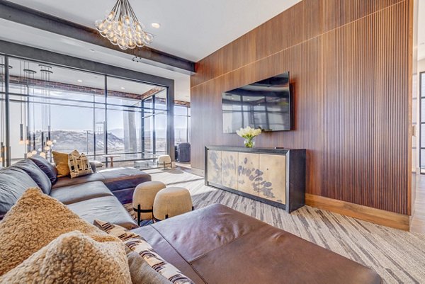 Stylish clubhouse with modern seating and entertainment areas at Reveal Apartments