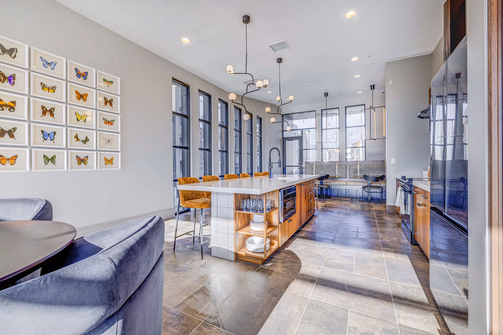 Clubhouse featuring modern decor and ample seating at Reveal Apartments