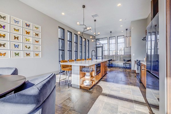 Clubhouse featuring modern decor and ample seating at Reveal Apartments