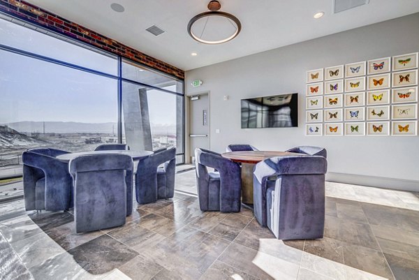 Chic clubhouse with modern decor at Reveal Apartments, perfect for social gatherings and relaxation