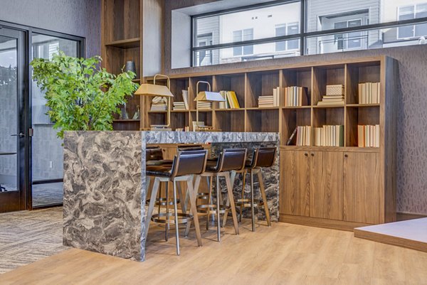 Modern clubhouse with stylish seating and open space at Reveal Apartments
