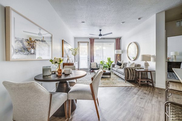 Elegant dining room with modern furnishings at Reveal Apartments