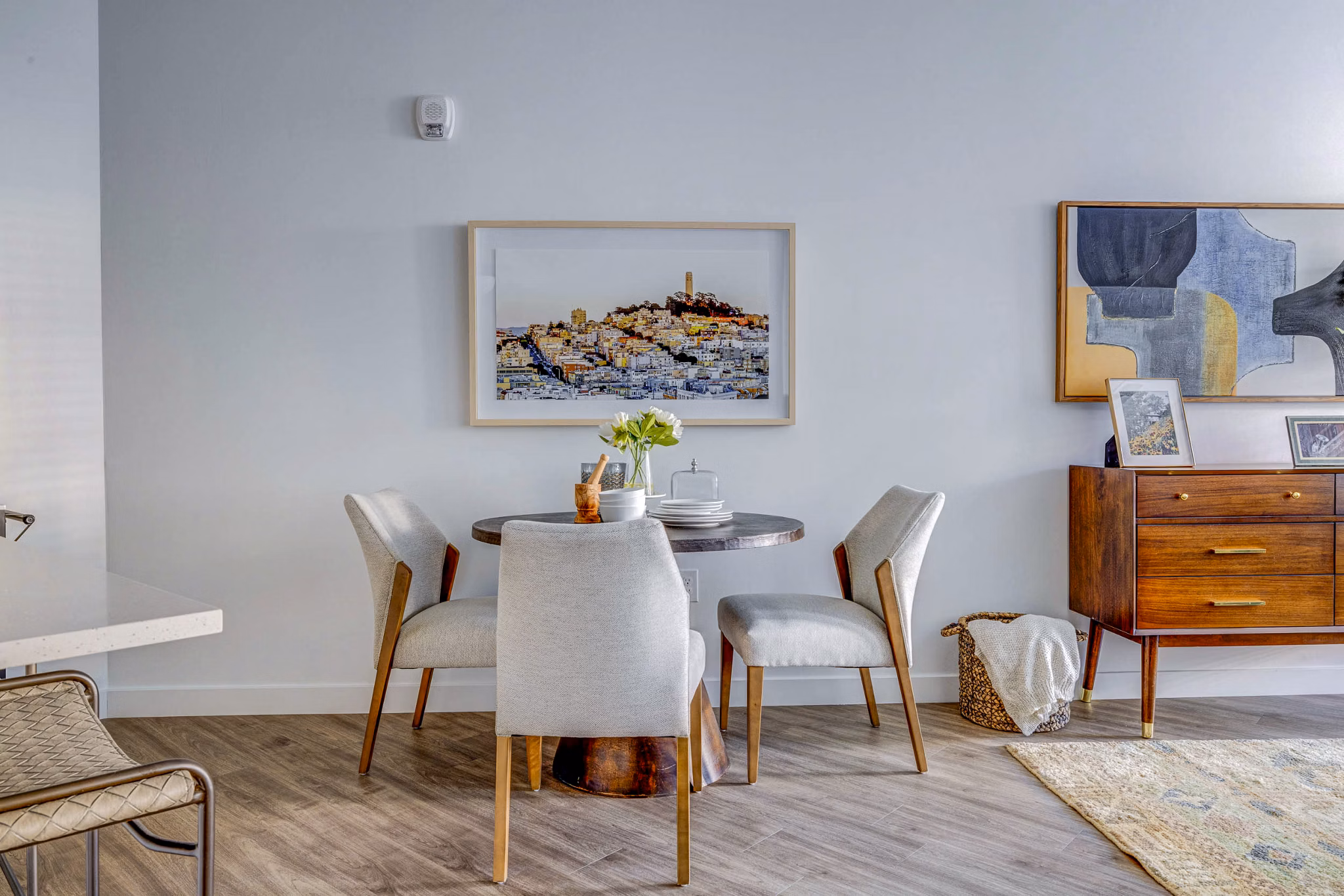 Dining room featuring modern decor and elegant lighting at Reveal Apartments