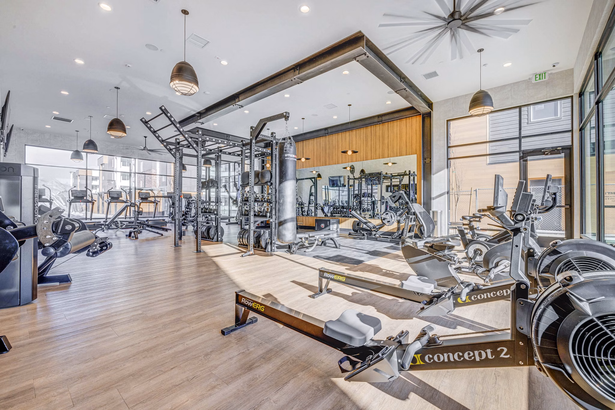 State-of-the-art fitness center at Reveal Apartments with modern equipment for exercise and wellness