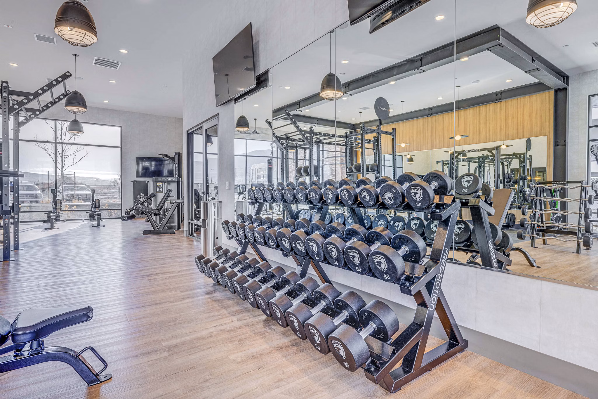 State-of-the-art fitness center with modern equipment at Reveal Apartments