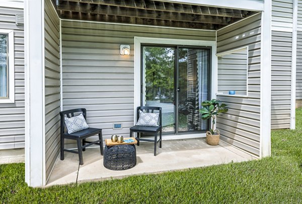 Modern furnished patio with greenery at Cobalt Ridge Apartments, perfect for relaxation and social gatherings in luxury living community
