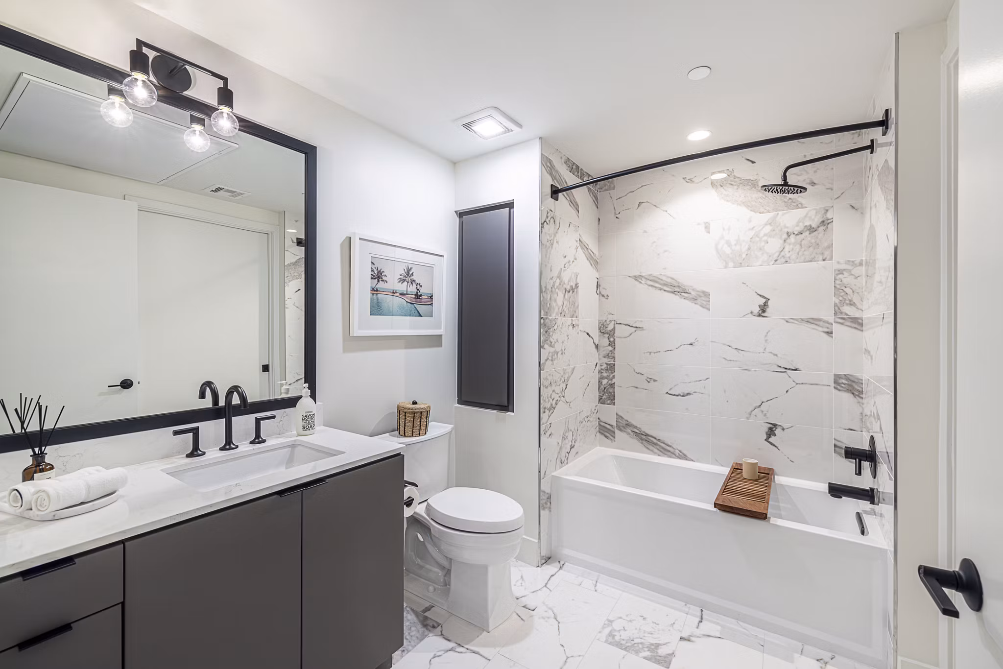 Hollywood Park Apartments: Modern bathroom with sleek fixtures and elegant marble countertops, ideal for luxury living