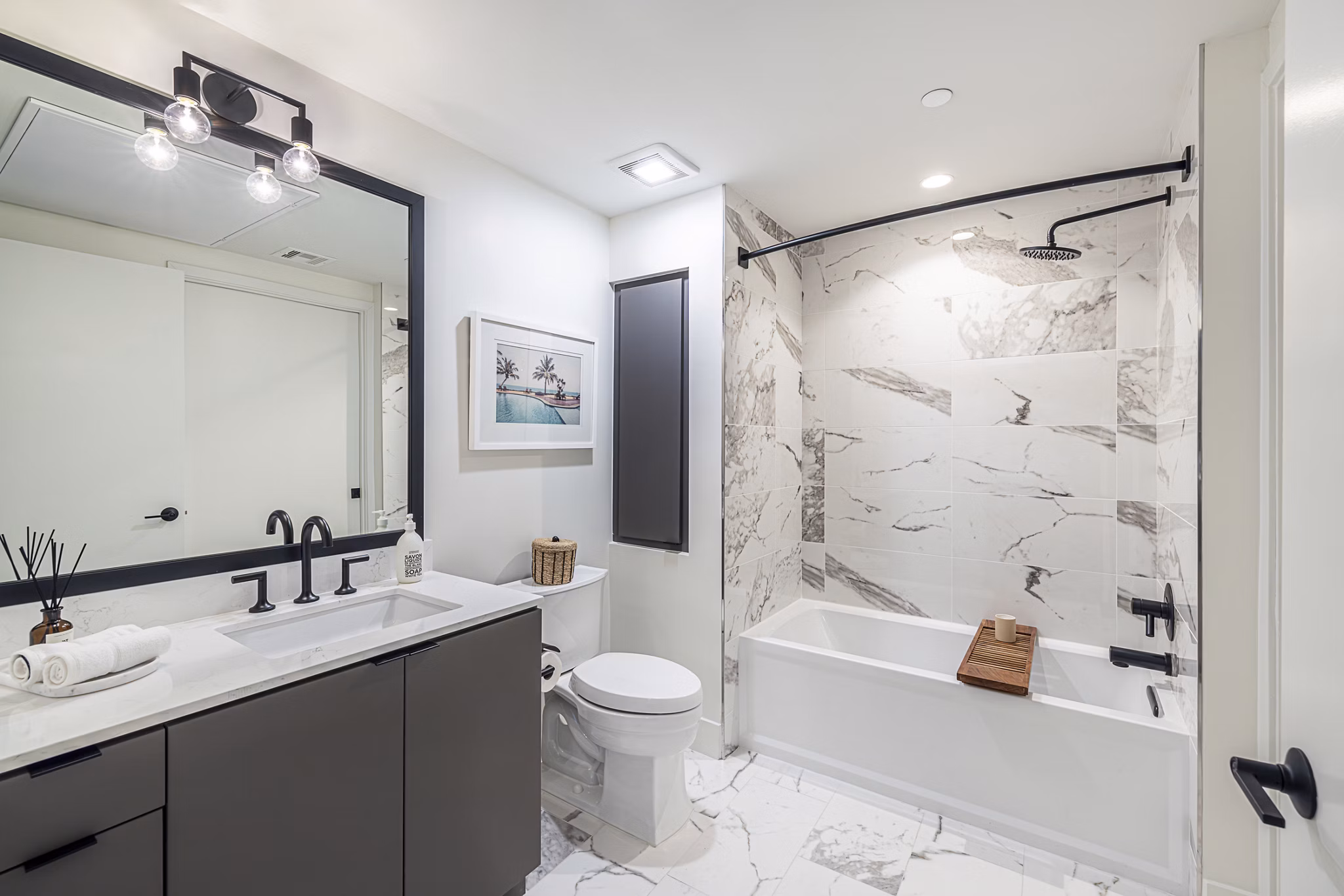 Hollywood Park Apartments: Modern bathroom with sleek fixtures and elegant marble countertops, ideal for luxury living