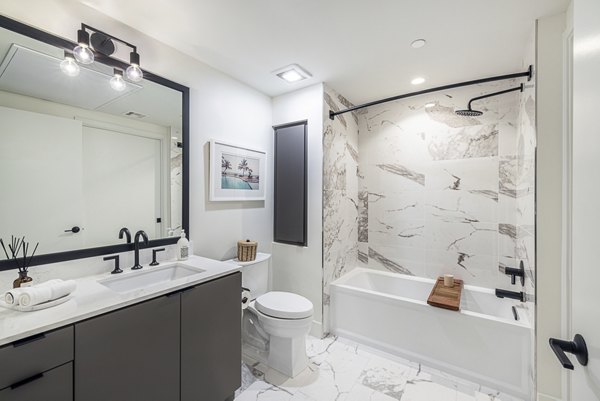Hollywood Park Apartments: Modern bathroom with sleek fixtures and elegant marble countertops, ideal for luxury living