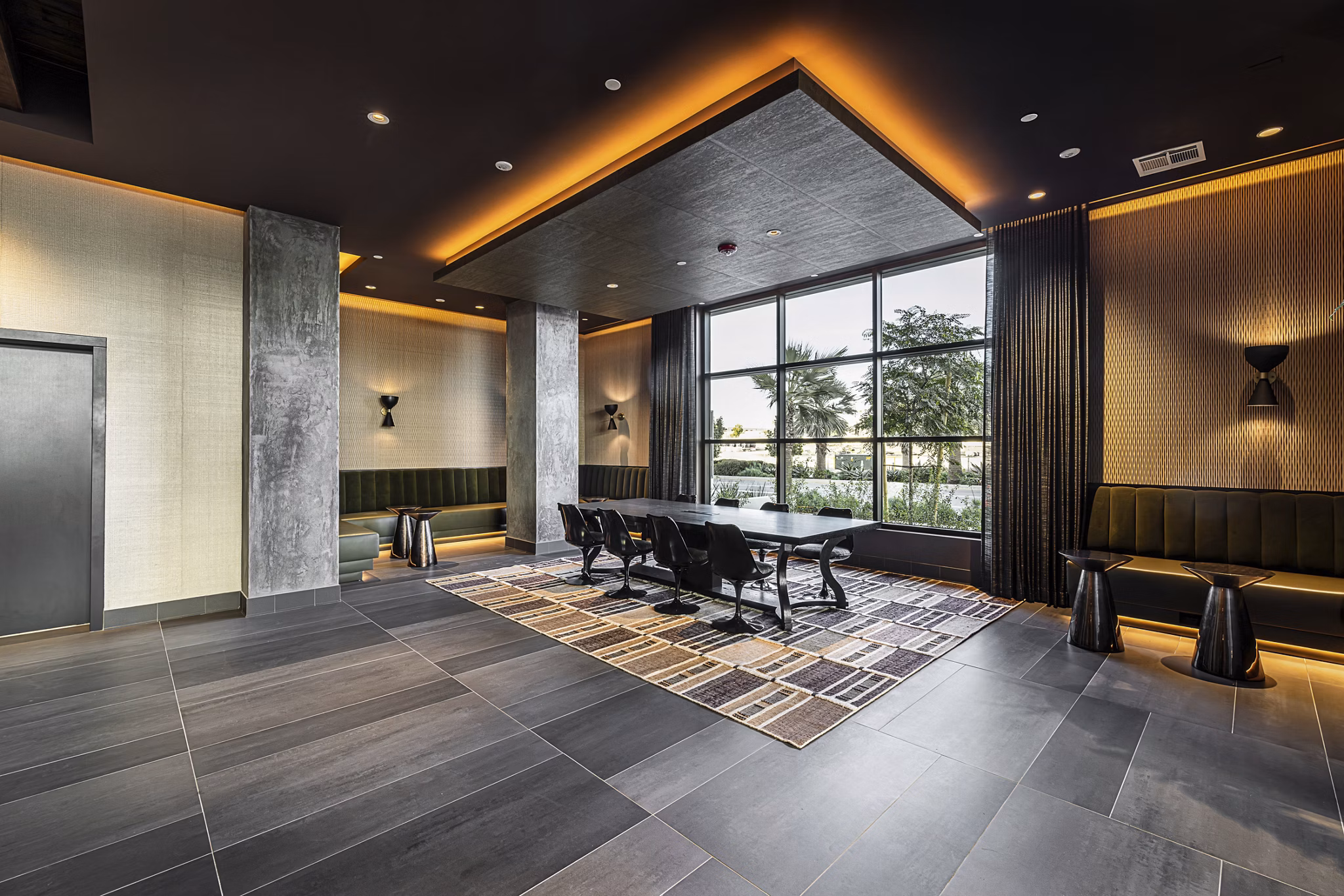 Elegant clubhouse with modern seating and vibrant decor at Hollywood Park Apartments