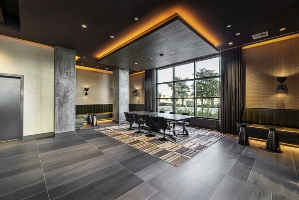 Elegant clubhouse with modern seating and vibrant decor at Hollywood Park Apartments